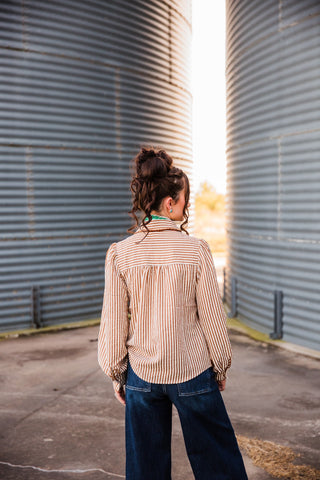 Back view of the striped Buck Scallop Top showing a horizontal-striped yoke, gathered back and curved hem.