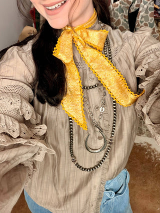 Women’s Western neck scarf in golden yellow by allie falcon styled with peyton mocha top big country's western wear