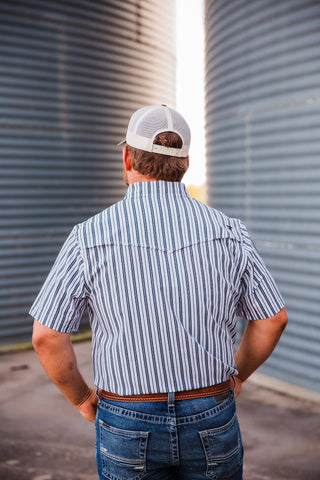 Back view of the Jack in Black pearl snap showing black-and-white vertical stripes, short sleeves and a Western back yoke.