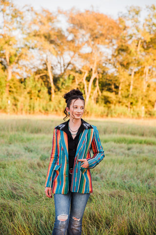 Front view of the Jade Serape Blazer showing multicolored vertical stripes, notched lapels and flap pockets.