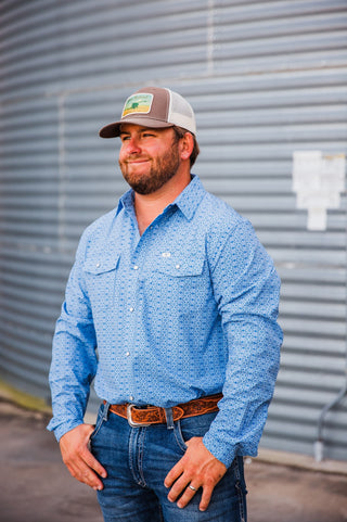 Angled front view of the blue patterned Jesse long-sleeve pearl snap, showing its collar, snap front and chest pockets.