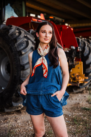 Women’s Western denim shorts paired with Blue Haven swing top