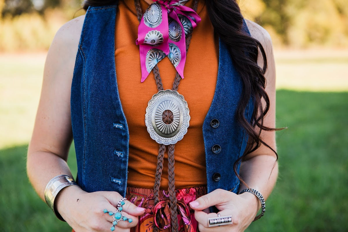 Western statement bolo necklace with braided leather cords and vintage-inspired silver concho double j saddlery