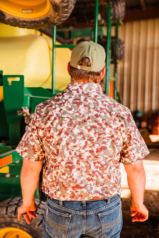 Rear fit of the Camo Lite short sleeve pearl snap shirt, showing the camouflage pattern and Western back yoke with jeans.