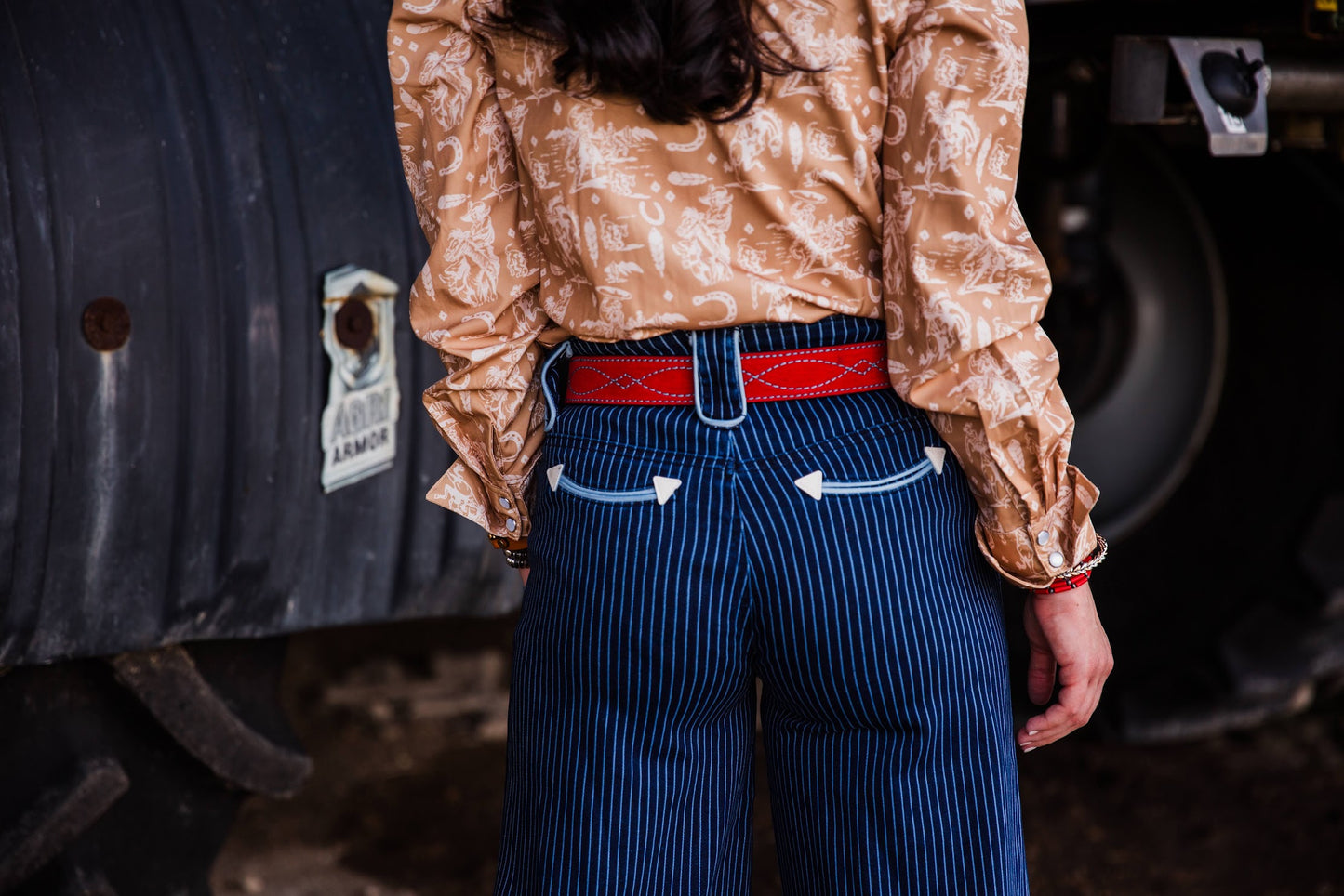 Women’s high waisted wide leg pinstripe jeans by Howdy Hanny styled with a Western pearl snap
