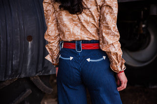Premium red suede leather cowgirl belt with turquoise stitching styled with women’s Western outfit by double j saddlery