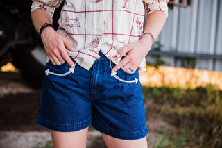 Women’s Western denim shorts with white piping and arrow pocket details by howdy hanny