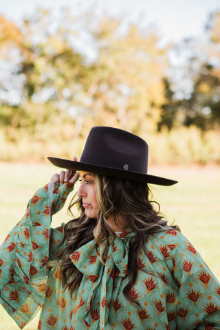 Women’s chocolate brown Western wool hat with 4 inch brim styled for a modern cowgirl outfit