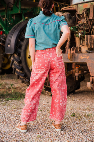 Back view of Desert Bandana Western Barrel Jeans, showing pink paisley denim, two back pockets and curved leg seams.