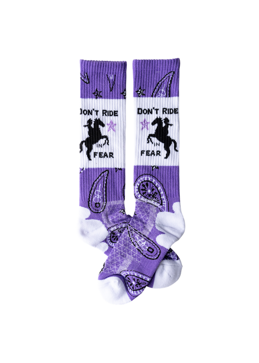 Purple and white socks with horse design and text on a white background
