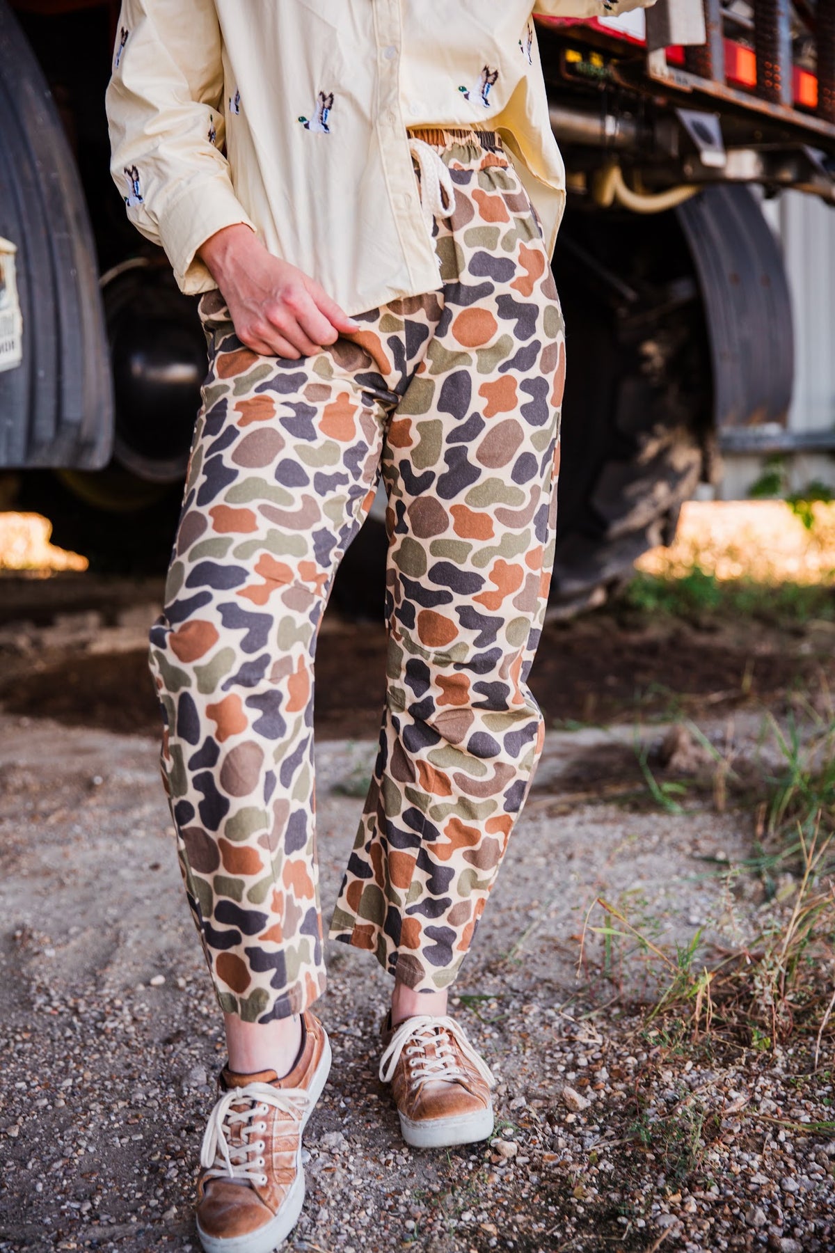 Close-up of Duck Camo Barrel Pants with elastic drawstring waist and multicolor camouflage print by turquoise haven