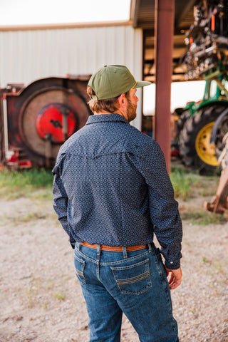 Rear detail of the Silas black pearl snap by Ferrell, highlighting the pointed back yoke, geometric pattern and snap cuffs.