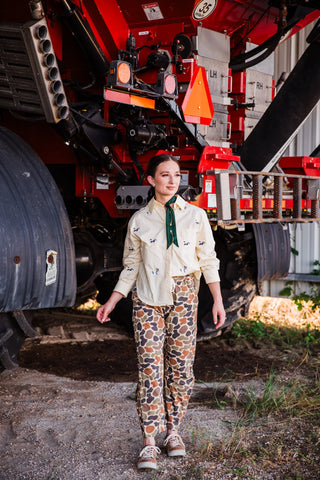 Women’s Western camouflage pants in vintage duck camo print styled with casual sneakers by turquoise haven