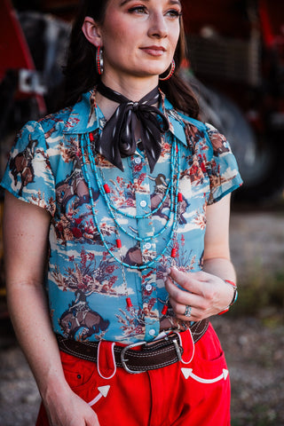 Turquoise cowgirl button-up top featuring floral and bucking horse print by turquoise haven