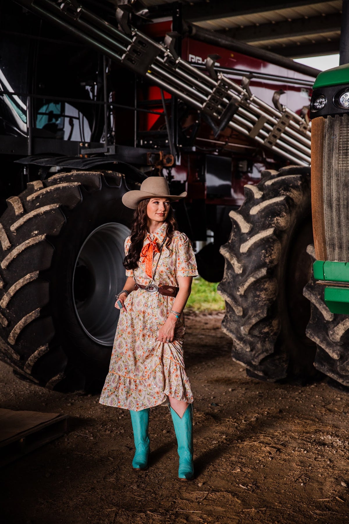 Women’s Western floral midi dress styled with cowboy hat, leather belt and turquoise boots