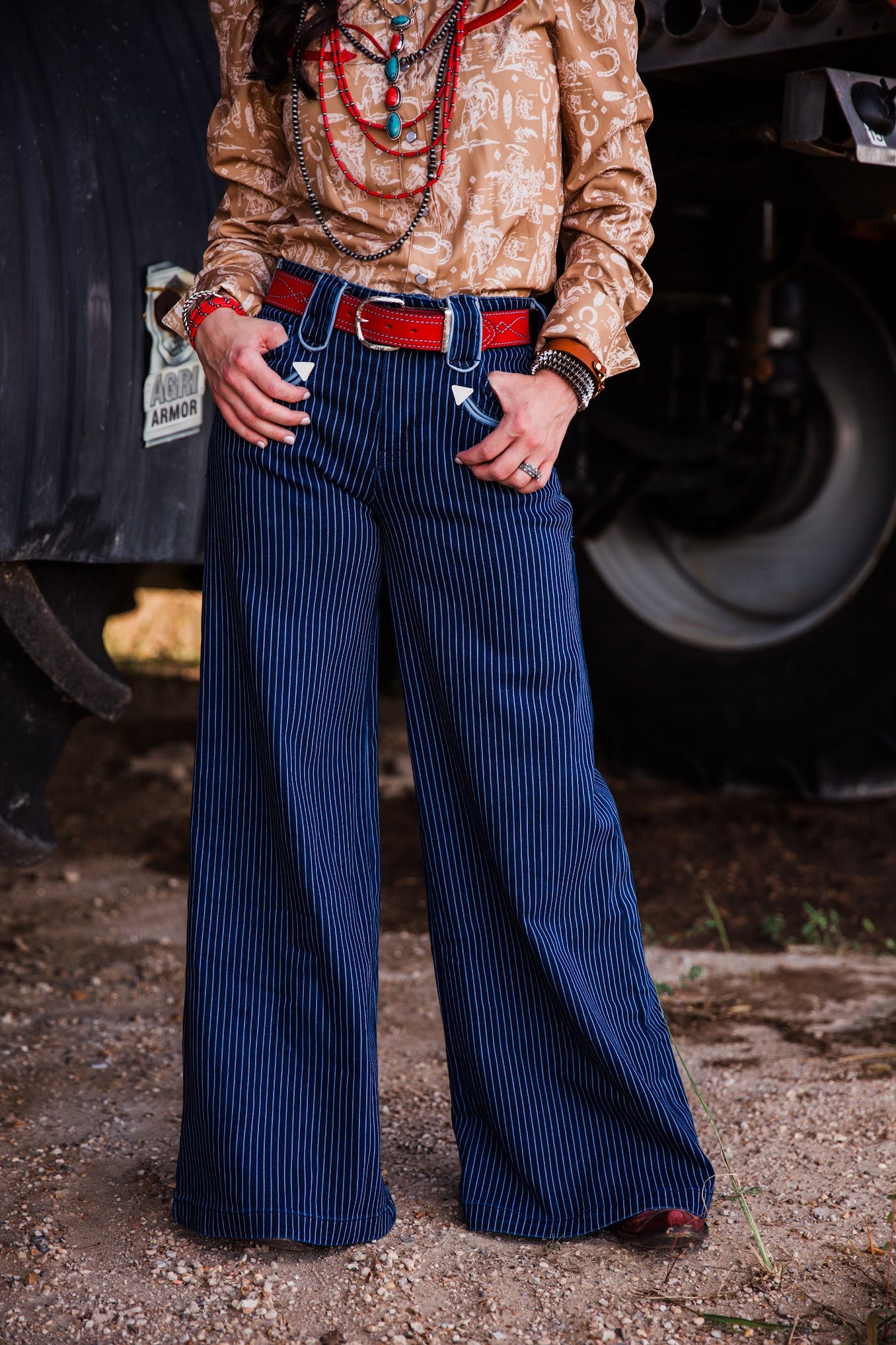 Blue Bonnet women’s dark denim pinstripe wide leg Western jeans styled with a red leather belt