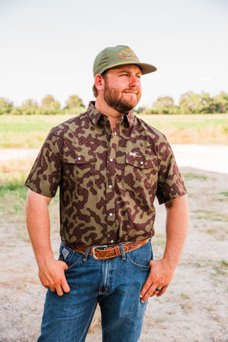 Front view of the Gage Camo short sleeve pearl snap shirt, showing brown and olive camouflage and two flap chest pockets.