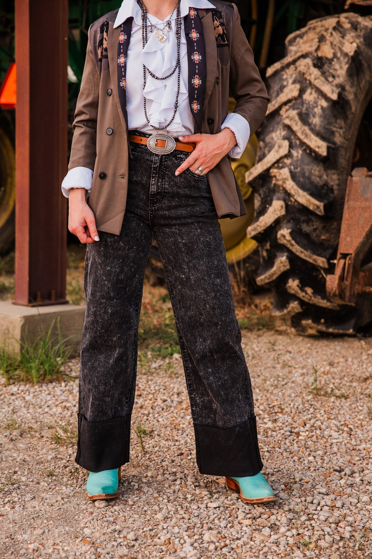 Honey Black Stone jeans shown from waist to hem, highlighting the mottled denim wash, front pockets and wide cuffed legs.