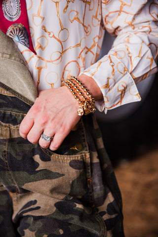 close up of sleeve and cuff. Ivory Bit Pearl Snap, Soft, lightweight woven fabric