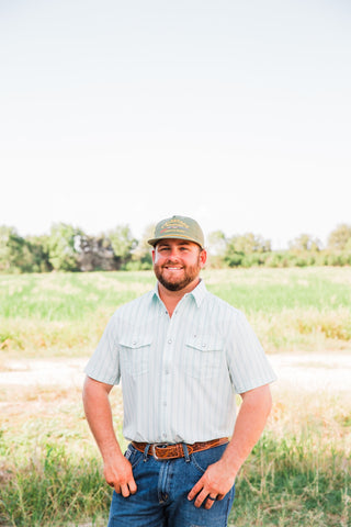 Front view of the Jack in Green short sleeve pearl snap shirt with subtle vertical stripes and two flap chest pockets.