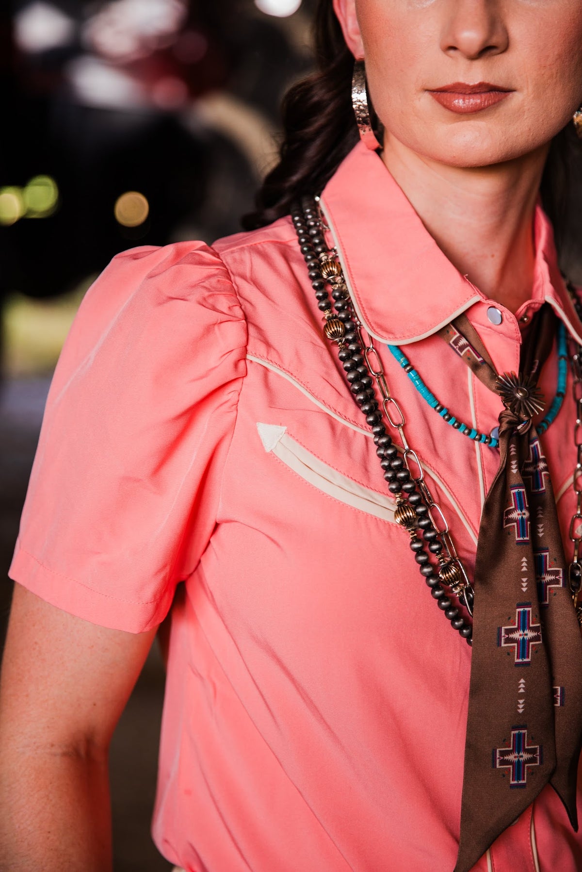 Women’s short sleeve peach Western pearl snap shirt with contrast yoke and pocket detailing by howdy hanny