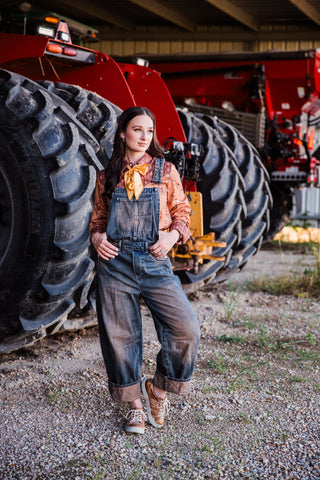 Women’s dark wash Western overalls with cuffed barrel legs and relaxed workwear fit