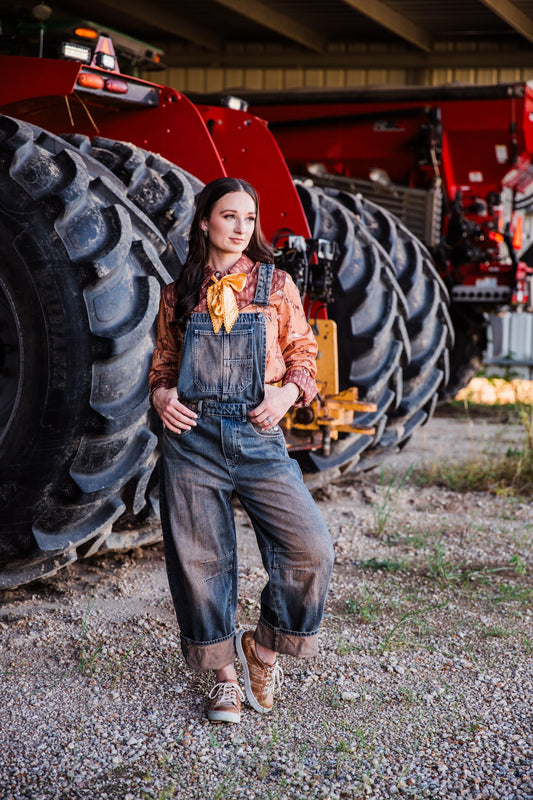 Women’s dark wash Western overalls with cuffed barrel legs and relaxed workwear fit