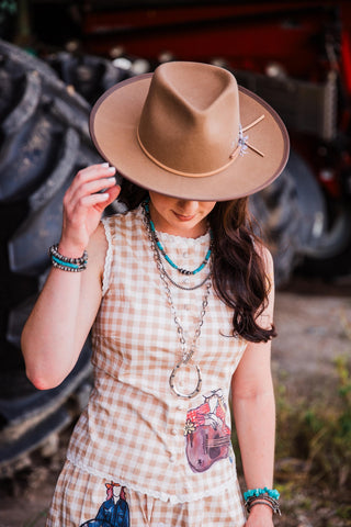 Women’s brown wool felt cowboy hat with structured crown and wide brim Western design