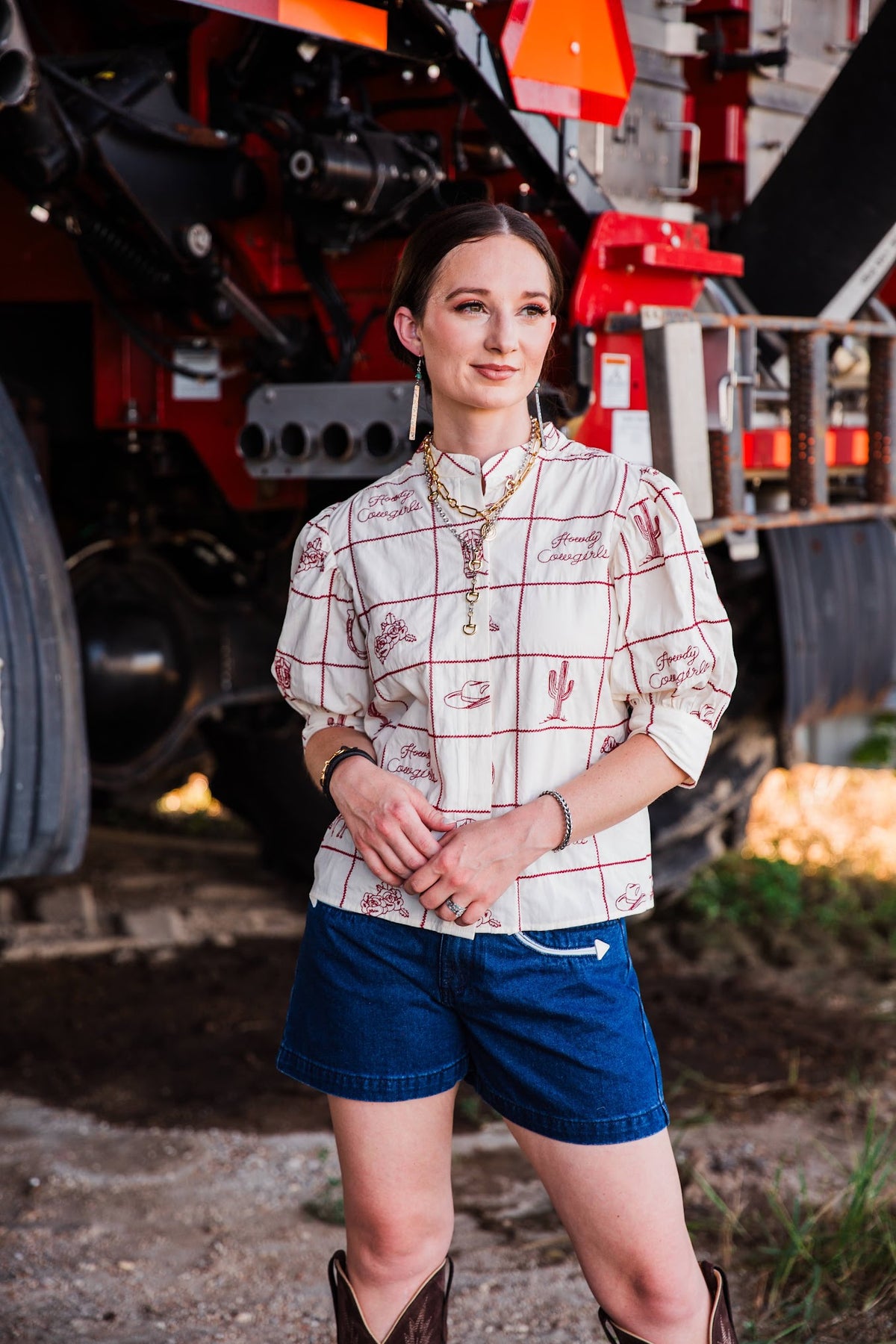 Blue women’s cowgirl denim shorts styled with an embroidered Western blouse by howdy hanny