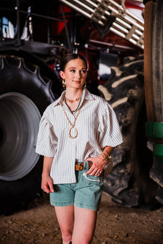 The Outlaw Seersucker Top women’s striped Western button-down shirt styled with denim shorts