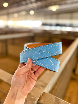 Close-up of the Powder Blue Suede Belt strap, showing suede texture, white figure-eight gunslinger stitching and dark edges.