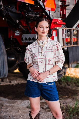 Women’s embroidered Western blouse featuring cowgirl, cowboy boot, cactus and horseshoe details