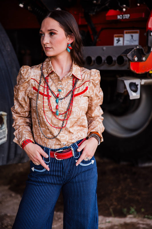 Saddle Up Sweetheart Pearl Snap women’s tan Western shirt with cowboy toile print and red piping