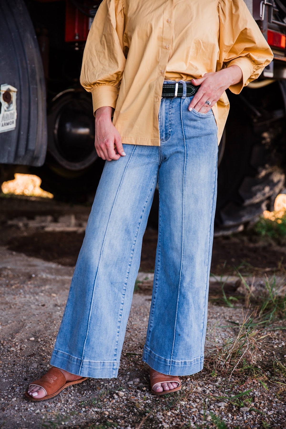 Women’s light wash high rise jeans with relaxed wide leg fit and front seam detail