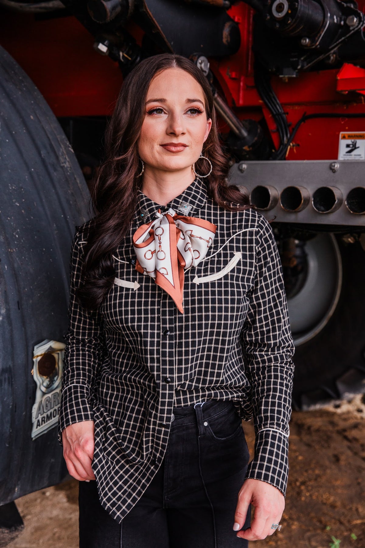 Silver-tone Stamped Dangle Hoop Earrings styled with a black checked Western shirt, printed neck scarf and black jeans.