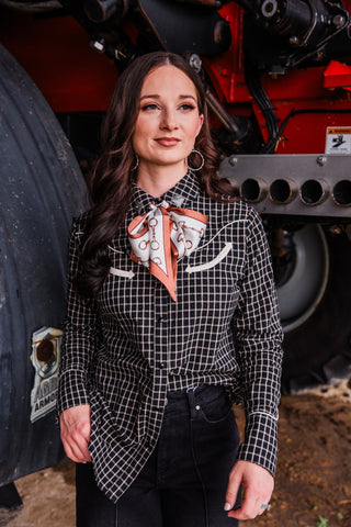 Silver-tone Stamped Dangle Hoop Earrings styled with a black checked Western shirt, printed neck scarf and black jeans.