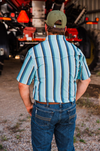 Back view of the Tristan blue striped short sleeve pearl snap shirt, showing its Western yoke and vertical stripe pattern.
