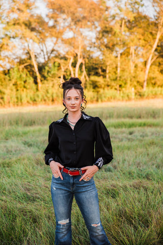Front outfit view of the black Midnight Rider blouse by Turquoise Haven, showing button closure and horse-embroidered cuffs.