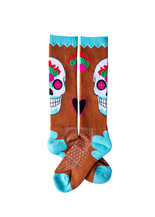 Colorful socks with skull designs on a white background